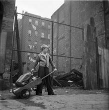 Shoe Shine Boy [Mickey carrying equipment with a wheelbarrow.]