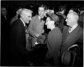 Dale Carnegie [Dale Carnegie speaking with a group of people.]