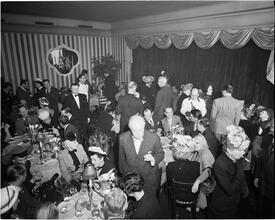 Champagne Cholly Book Party [People socializing at a party.]