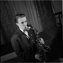 Swing Band Contest Sponsored by LOOK [Boy playing a saxophone.]