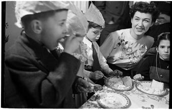 Deaf Children [Children eating cake at a party.]