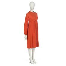 Dress in cadmium orange wool jersey with orange leather belt