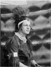 [Man wearing a headdress.]