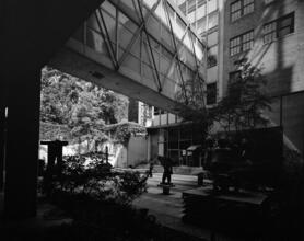 [Unidentified courtyard beneath skyway.]