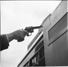 Paddy Wagon [Close-up of an actor holding a gun on the television show Paddy Wagon.]