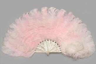Folding feather fan of pink ostrich with attached aigrette