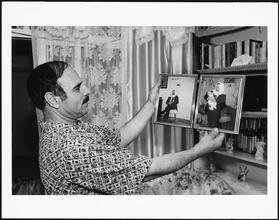 B & B Electronics Owner, Bay Ridge, Brooklyn, with photographs of himself in Jerusalem before emigration