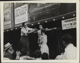 [Sideshow performers on the Coney Island midway.]