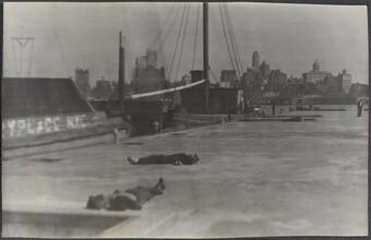 [Destitute men sleeping on dock.]