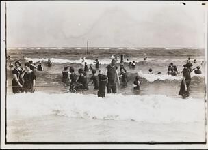 [People swimming at beach.]