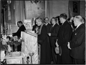 [Priest at a pulpit.]