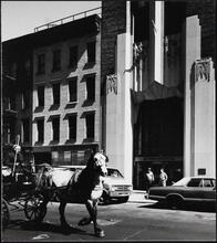 [Carriage driver passing the Bell Telephone Building, 435 West 50th Street.]