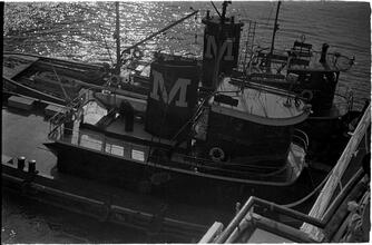 [Overhead view of two Moran tugboats.]