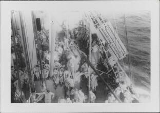 [Crew members on deck of ship.]