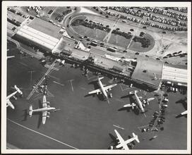 For 34 Years of Loyal Service - Eric S. Barron [Aerial view of planes on the ground at John F. Kennedy Airport.]