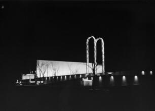[Night view of the Textiles building, New York World's Fair.]