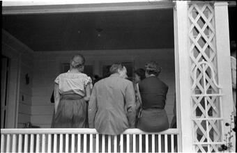 [Social gathering on porch.]