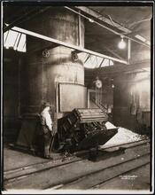 [Interior, manufacturing shop, metal melting furnace oven.]