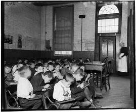 East Side Public Schools 2. Class without desks in the Essex Market School.