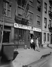 [Men leaving McSorley's Old Ale House, 15 East 7th Street.]