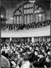 [Interior of a full church.]