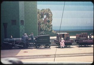 [Actors with a replica of a Baltimore & Ohio train during the Parade of Railroads show.]