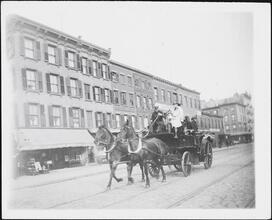 [Horse-drawn fire engine.]