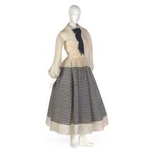 Sailor-style dress in off-white organdy with applied bands of navy blue silk braid