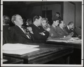 [Bobby Clark, John Cecil Holm, Paula Stone, Michael Sloane, Bert Mayer, Paul Best and John Kennedy (reflected in the mirror) watching a rehearsal for "Sweethearts".]