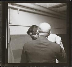 Rocky Graziano, He's a Good Boy Now [Man speaking into Rocky Graziano's ear.]