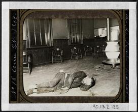 Police Station Lodgers 19. The Single typhus lodger in Eldridge Street, he lay by the stove in the policemen's room no one dreaming what ailed him.