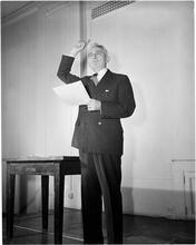 Dale Carnegie [Dale Carnegie teaching a class on public speaking.]