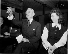 Dale Carnegie [Mrs. Dale Carnegie watches her husband criticize student speakers.]