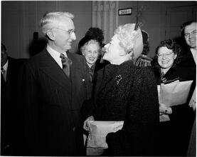 Dale Carnegie [Dale Carnegie talking to a woman.]
