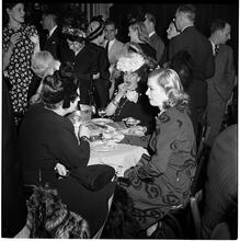 Champagne Cholly Book Party [Women talking at a table.]