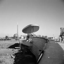 [Construction of the New York World's Fair site, with the frames of the Trylon and Perisphere in the background.]