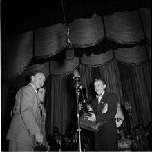 Swing Band Contest Sponsored by LOOK [Boy receiving a trophy.]