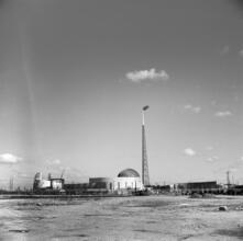 [Construction of the World's Fair site, with the steel frames of the Trylon and Perisphere visible.]