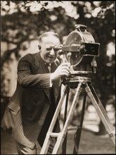 [Al Smith with a camera.]