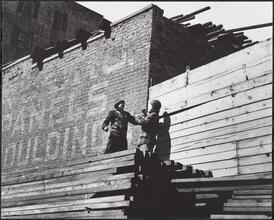 Sparring atop a Lumber Pile Two Stories High.