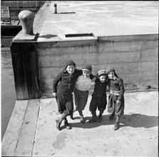 Waterfront [Four boys on a dock.]