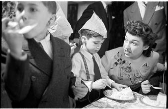 Deaf Children [Eating cake at a party.]
