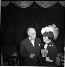 Champagne Cholly Book Party [Man and woman talking.]