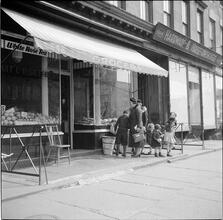 Family in Front of Grocery
