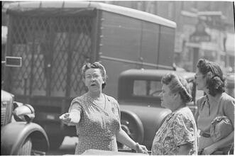 Street Conversations [Three women talking on the street.]