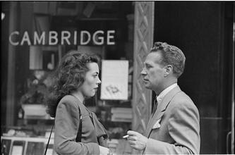 Street Conversations [Man and woman talking on the street.]