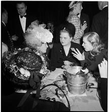 Champagne Cholly Book Party [Women talking at a table.]