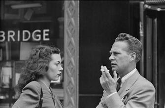 Street Conversations [Man and woman talking on the street.]