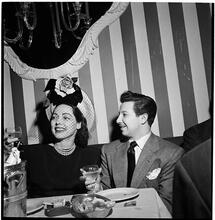 Champagne Cholly Book Party [Man and woman toasting.]