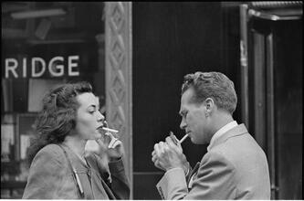 Street Conversations [Man and woman talking on the street.]